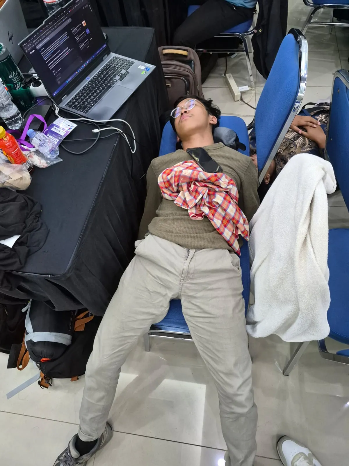 Sleeping on row of chairs
